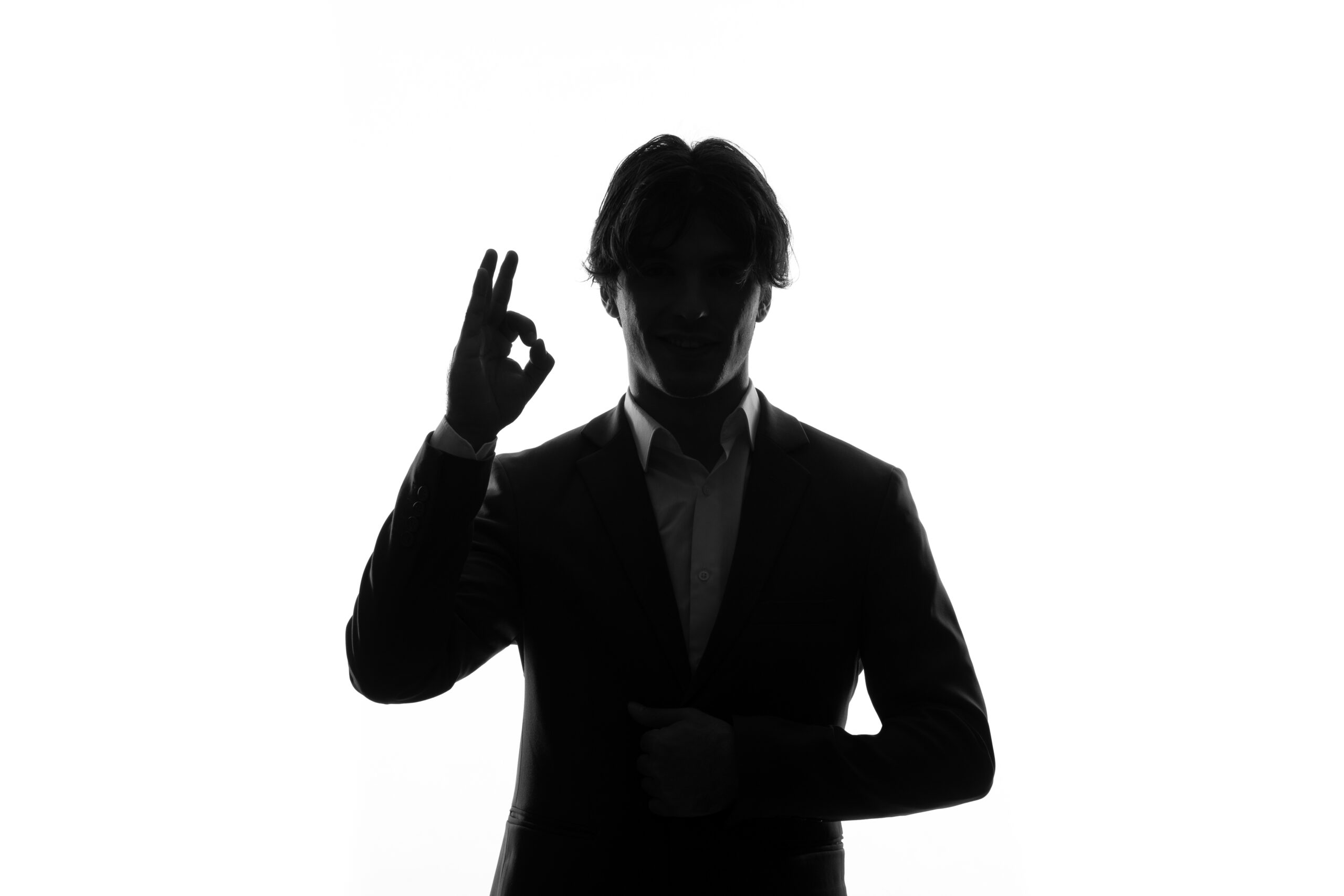 silhouette-man-strict-suit-seems-delighted-shadow-back-lit-white-background